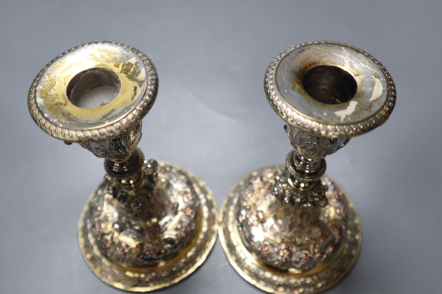 A pair of Elkington electrotype cast plated candlesticks, height 14cm